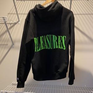 PLEASURES Champion Hoodie. Size Medium. Black with Green Letters.